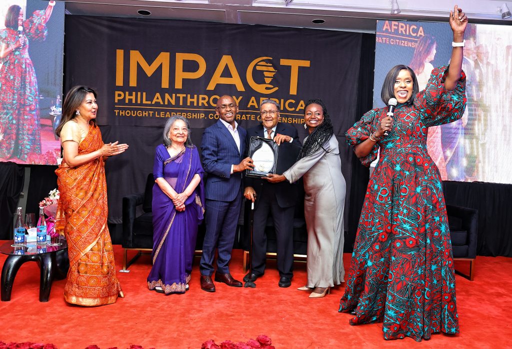 Dr. Manu Receiving the the inaugural IMPACT Lifetime Achievement Award in Philanthropy from CEO of Safaricom, Peter Ndegwa and Faustina Fynn-Nyame, Executive Director, Africa, CIFF